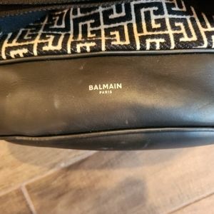 Used Balmain 1945 unisex monogram foldover back pack with adjustable straps.